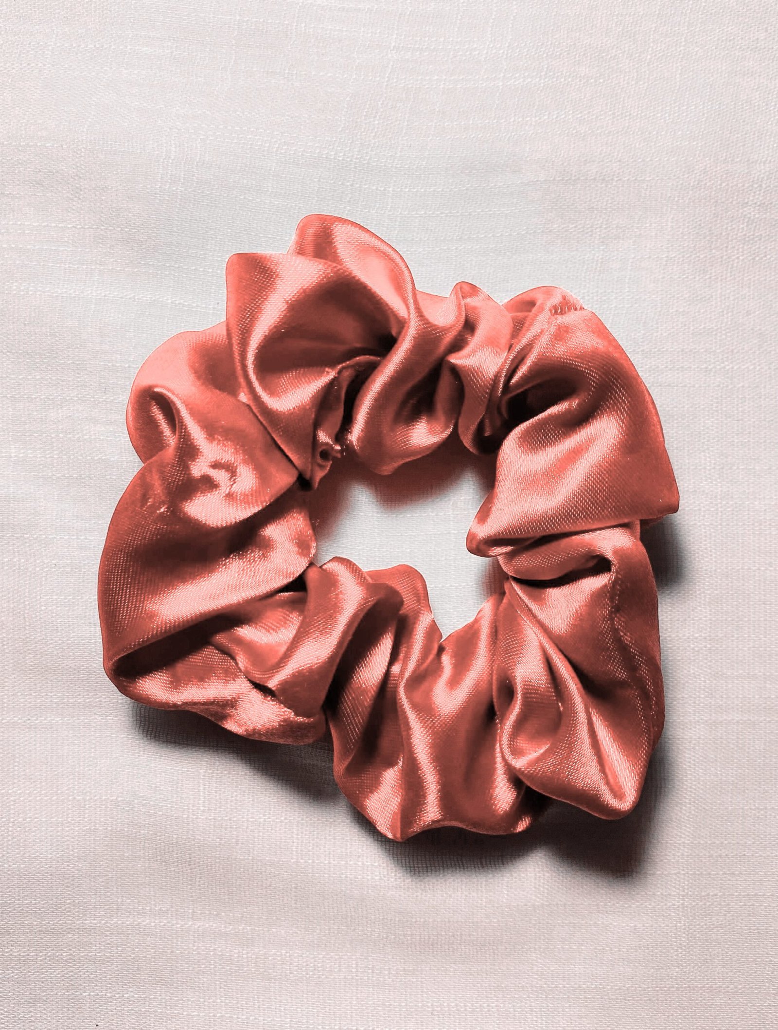 Collection of stylish scrunchies available for reducing hair breakage and boosting hair care.