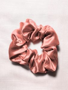 Collection of stylish scrunchies available for reducing hair breakage and boosting hair care.